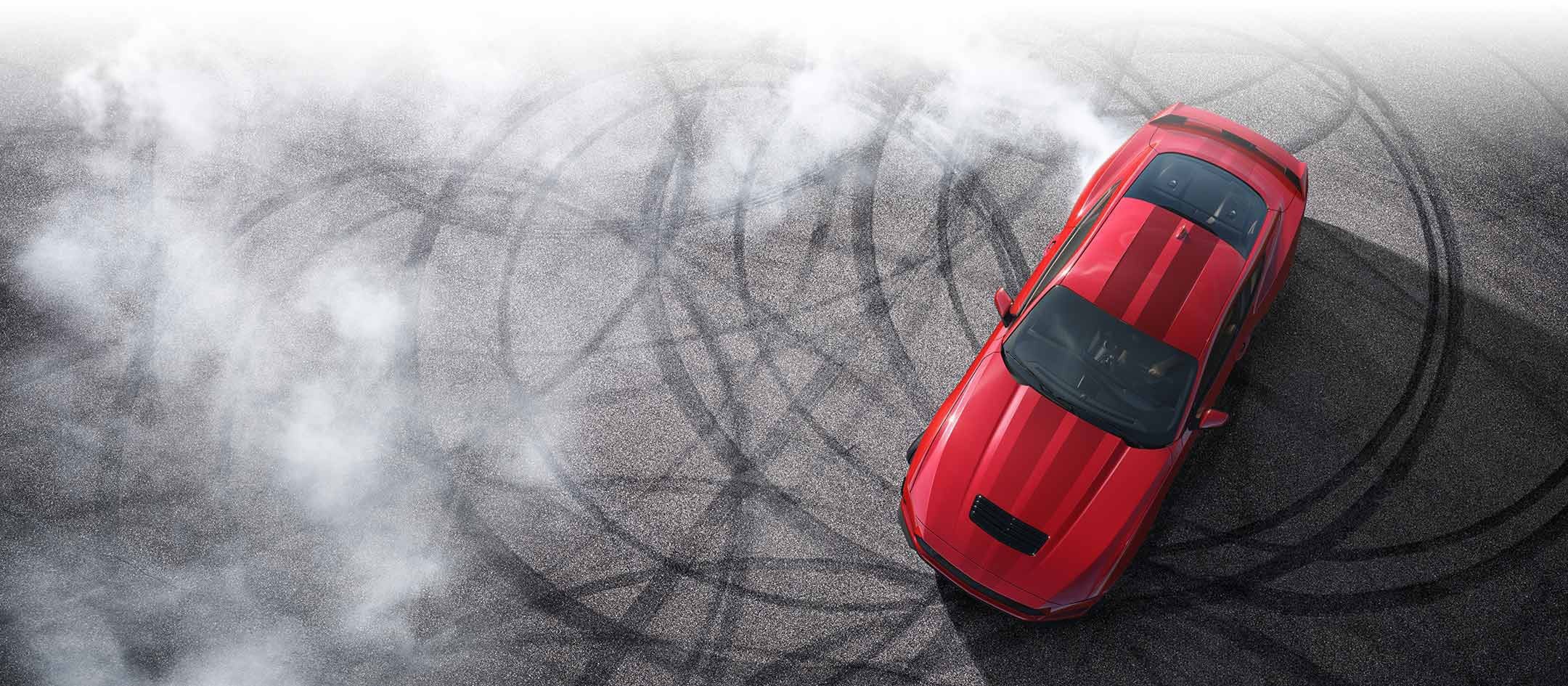 Overhead view of a 2024 Ford Mustang® model with tire tracks on pavement | Ed Morse Ford Lebanon in Lebanon MO