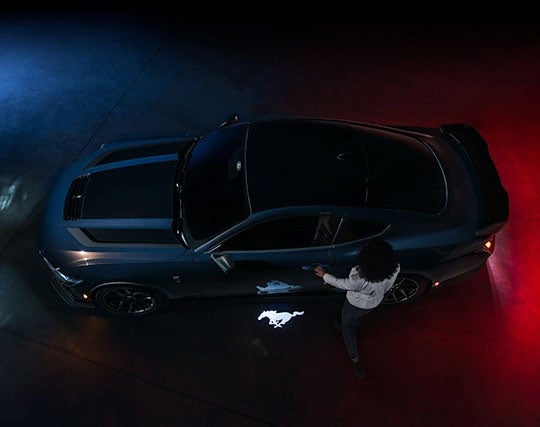 2024 Ford Mustang® Dark Horse™ model with a driver approaching the vehicle | Ed Morse Ford Lebanon in Lebanon MO