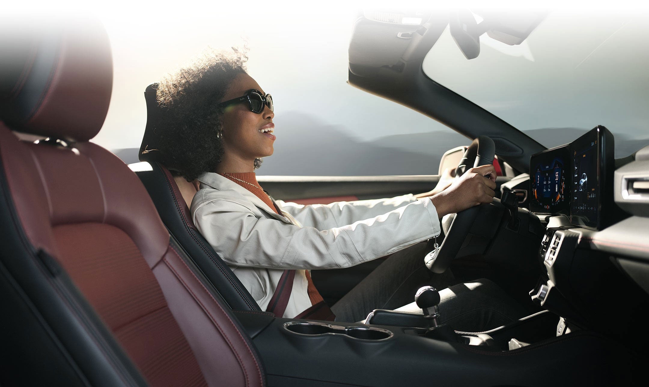 Person sitting in the driver’s seat of a 2024 Ford Mustang® convertible | Ed Morse Ford Lebanon in Lebanon MO